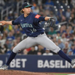 Apr 19, 2025; Toronto, Ontario, CAN; Seattle Mariners starting pitcher Logan Gilbert (36) delivers a pitch against the Toronto Blue Jays in the first inning at Rogers Centre. Mandatory Credit: Dan Hamilton-Imagn Images