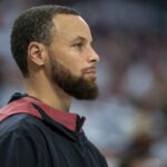 May 8, 2025; Minneapolis, Minnesota, USA; Golden State Warriors guard Stephen Curry (30) looks on from the bench against the Minnesota Timberwolves in the second half during game two of the second round for the 2025 NBA Playoffs at Target Center.