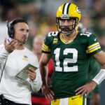Green Bay Packers head coach Matt LaFleur talks with quarterback Aaron Rodgers (12) in between quarters against the Chicago Bears during their game on Sep 18, 2022, in Green Bay, Wisconsin.