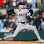 May 25, 2025; Denver, Colorado, USA; New York Yankees relief pitcher Luke Weaver (30) pitches in the ninth inning against the Colorado Rockies at Coors Field. Mandatory Credit: Isaiah J. Downing-Imagn Images