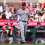 May 31, 2025; Atlanta, Georgia, USA; Boston Red Sox manager Alex Cora (13) makes a pitching change against the Atlanta Braves in the sixth inning at Truist Park. Mandatory Credit: Brett Davis-Imagn Images