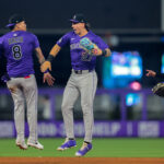 Jun 4, 2025; Miami, Florida, USA; Colorado Rockies shortstop Orlando Arcia (8) and left fielder Jordan Beck (27) celebrate after the game against the Miami Marlins at loanDepot Park. Mandatory Credit: Sam Navarro-Imagn Images