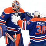 Jun 4, 2025; Edmonton, Alberta, CAN; Edmonton Oilers goaltender Stuart Skinner (74) reacts with goaltender Calvin Pickard (30) after defeating the Florida Panthers in overtime for game one of the 2025 Stanley Cup Final at Rogers Place. Mandatory Credit: Walter Tychnowicz-Imagn Images