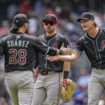 Jun 5, 2025; Cumberland, Georgia, USA; Arizona Diamondbacks third baseman Eugenio Suarez (28) reacts with relief pitcher Shelby Miller (18) after the Diamondbacks defeated the Atlanta Braves at Truist Park. Mandatory Credit: Dale Zanine-Imagn Images D-Backs