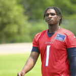 Jun 10, 2025; Nashville, TN, USA; Tennessee Titans quarterback Cam Ward (1) walks off the field during minicamp at Nissan Stadium. Mandatory Credit: Steve Roberts-Imagn Images