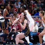 Jun 17, 2025; Indianapolis, Indiana, USA; Connecticut Sun guard Jacy Sheldon (4) fouls Indiana Fever guard Caitlin Clark (22) in the second half at Gainbridge Fieldhouse.