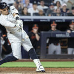 MLB All-Star Jun 20, 2025; Bronx, New York, USA; New York Yankees right fielder Aaron Judge (99) hits a single in the sixth inning against the Baltimore Orioles at Yankee Stadium. Mandatory Credit: Wendell Cruz-Imagn Images