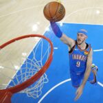 Jun 22, 2025; Oklahoma City, Oklahoma, USA; Oklahoma City Thunder guard Alex Caruso (9) dunks against the Indiana Pacers during the first half of game seven of the 2025 NBA Finals at Paycom Center.