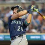 Jun 23, 2025; Minneapolis, Minnesota, USA; Seattle Mariners catcher Cal Raleigh (29) hits a two run home run against the Minnesota Twins in the ninth inning at Target Field. Mandatory Credit: Jesse Johnson-Imagn Images