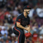 Jun 27, 2025; Cincinnati, Ohio, USA; Cincinnati Reds starting pitcher Nick Martinez (28) reacts after a play in the eighth inning against the San Diego Padres at Great American Ball Park.
