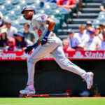 Jun 29, 2025; Anaheim, California, USA; Washington Nationals left fielder James Wood (29) hits a single against the Los Angeles Angels during the first inning at Angel Stadium. Mandatory Credit: Gary A. Vasquez-Imagn Images