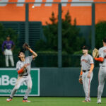 Jun 10, 2025; Denver, Colorado, USA; San Francisco Giants center fielder Jung Hoo Lee (51) makes the final out of the game as right fielder Mike Yastrzemski (5) and second baseman Tyler Fitzgerald (49) look on in the ninth inning against the Colorado Rockies at Coors Field.