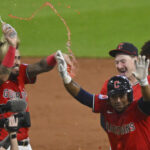 Jun 25, 2025; Cleveland, Ohio, USA; The Cleveland Guardians celebrate a game-winning single by third baseman Jose Ramirez (front right) in the tenth inning against the Toronto Blue Jays at Progressive Field.