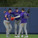 Jun 3, 2025; Miami, Florida, USA; Colorado Rockies left fielder Jordan Beck (27), center fielder Brenton Doyle (9), and right fielder Mickey Moniak (22) celebrate after the game against the Miami Marlins at loanDepot Park.