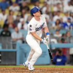 Jun 18, 2025; Los Angeles, California, USA; Los Angeles Dodgers catcher Will Smith (16) hits a walkoff home run against the San Diego Padres at Dodger Stadium.