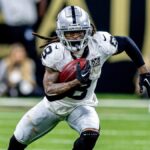 Dec 29, 2024; New Orleans, Louisiana, USA; Las Vegas Raiders running back Ameer Abdullah (8) rushes against New Orleans Saints cornerback Travion Fluellen (26) during the second half at Caesars Superdome.
