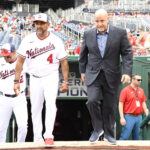 Jul 17, 2022; Washington, District of Columbia, USA; Washington Nationals manager Dave Martinez (4) and general manager Mike Rizzo (right) step onto the field for a pre-game ceremony at Nationals Park. Mandatory Credit: James A. Pittman-USA TODAY Sports