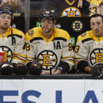 Oct 11, 2023; Boston, Massachusetts, USA; Left to right, Boston Bruins defenseman Charlie McAvoy (73), right wing David Pastrnak (88) and left wing Brad Marchand (63) on the bench against the Chicago Blackhawks during the first period at TD Garden. Mandatory Credit: Winslow Townson-USA TODAY Sports