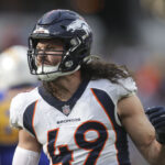 Dec 10, 2023; Inglewood, California, USA; Denver Broncos inside linebacker Alex Singleton (49) celebrates in the first half in a game against the Los Angeles Chargers at SoFi Stadium.