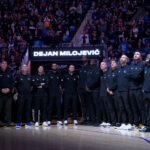 Jan 24, 2024; San Francisco, California, USA; Golden State Warriors coaching staff stand in honor of the late assistant coach Dejan Milojevic before a game against the Atlanta Hawks at Chase Center.