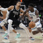 Jan 27, 2024; San Antonio, Texas, USA; NBA; Minnesota Timberwolves guard Anthony Edwards (5) drives to the basket against San Antonio Spurs forward Victor Wembanyama (1) during the second half at Frost Bank Center.