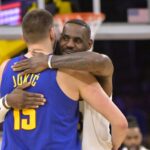 Mar 2, 2024; Los Angeles, California, USA; Los Angeles Lakers forward LeBron James (23) is greeted by Denver Nuggets center Nikola Jokic (15) at the start of the game at Crypto.com Arena. Mandatory Credit: Jayne Kamin-Oncea-USA TODAY Sports