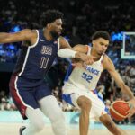 Aug 10, 2024; Paris, France; France power forward Victor Wembanyama (32) controls the ball against United States centre Joel Embiid (11) in the second half in the men's basketball gold medal game during the Paris 2024 Olympic Summer Games at Accor Arena. Mandatory Credit: Kyle Terada-USA TODAY Sports