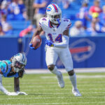 Aug 24, 2024; Orchard Park, New York, USA; Buffalo Bills wide receiver Chase Claypool (14) runs with the ball after making a catch against the Carolina Panthers during the second half at Highmark Stadium. Mandatory Credit: Gregory Fisher-USA TODAY Sports