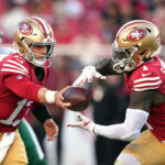 Sep 9, 2024; Santa Clara, California, USA; San Francisco 49ers quarterback Brock Purdy (left) hands off to wide receiver Deebo Samuel Sr. (right) during the second quarter against the New York Jets at Levi's Stadium. Mandatory Credit: Darren Yamashita-Imagn Images