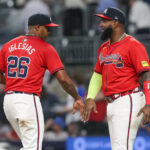 Sep 13, 2024; Atlanta, Georgia, USA; Atlanta Braves relief pitcher Raisel Iglesias (26) and designated hitter Marcell Ozuna (20) celebrate after a victory over the Los Angeles Dodgers at Truist Park. Mandatory Credit: Brett Davis-Imagn Images