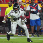 Sep 5, 2024; Kansas City, Missouri, USA; Baltimore Ravens tight end Isaiah Likely (80) runs the ball against the Kansas City Chiefs during the game at GEHA Field at Arrowhead Stadium. Mandatory Credit: Denny Medley-Imagn Images
