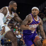 Oct 6, 2024; Palm Desert, California, USA; Phoenix Suns guard Bradley Beal (3) moves the ball against Los Angeles Lakers forward LeBron James (23) during the first half at Acrisure Arena. Mandatory Credit: David Frerker-Imagn Images