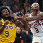 Oct 17, 2024; Phoenix, Arizona, USA; Los Angeles Lakers guard Bronny James (9) and Phoenix Suns guard Bradley Beal (3) battle for position during the second half at Footprint Center. Mandatory Credit: Joe Camporeale-Imagn Images
