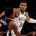 Nov 8, 2024; New York, New York, USA; Milwaukee Bucks forward Giannis Antetokounmpo (34) controls the ball against New York Knicks forward OG Anunoby (8) during the first quarter at Madison Square Garden. Mandatory Credit: Brad Penner-Imagn Images