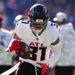 Nov 17, 2024; Denver, Colorado, USA; Atlanta Falcons safety Justin Simmons (31) warms up before the game against the Denver Broncos at Empower Field at Mile High. Mandatory Credit: Ron Chenoy-Imagn Images