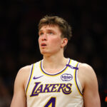 Nov 26, 2024; Phoenix, Arizona, USA; Los Angeles Lakers guard Dalton Knecht (4) against the Phoenix Suns during an NBA Cup game at Footprint Center.