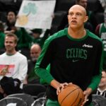 Nov 24, 2024; Boston, Massachusetts, USA; Boston Celtics guard Jordan Walsh (27) warms up before a game against the Minnesota Timberwolves during the first half at TD Garden. Mandatory Credit: Eric Canha-Imagn Images