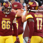 Nov 24, 2024; Landover, Maryland, USA; Washington Commanders tight end Zach Ertz (86) celebrates with Commanders wide receiver Terry McLaurin (17) after catching a touchdown pass against the Dallas Cowboys at Northwest Stadium. Mandatory Credit: Geoff Burke-Imagn Images