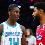Dec 20, 2024; Philadelphia, Pennsylvania, USA; Charlotte Hornets forward Moussa Diabate (14) reacts with Philadelphia 76ers forward Paul George (8) after the game at Wells Fargo Center. Mandatory Credit: Kyle Ross-Imagn Images