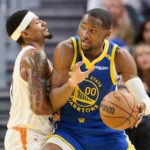 Dec 28, 2024; San Francisco, California, USA; Phoenix Suns guard Bradley Beal (3) defends against Golden State Warriors forward Jonathan Kuminga (00) during the third quarter at Chase Center. Mandatory Credit: Robert Edwards-Imagn Images