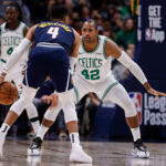Jan 7, 2025; Denver, Colorado, USA; NBA; Denver Nuggets guard Russell Westbrook (4) controls the ball as Boston Celtics center Al Horford (42) guards in the third quarter at Ball Arena.