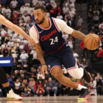 Jan 13, 2025; Inglewood, California, USA; LA Clippers guard Norman Powell (24) drives against Miami Heat guard Jaime Jaquez Jr. (11) during the second quarter at Intuit Dome.