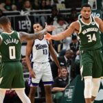 Jan 14, 2025; Milwaukee, Wisconsin, USA; Milwaukee Bucks forward Giannis Antetokounmpo (34) reacts with guard Damian Lillard (0) after scoring a basket in the second quarter against the Sacramento Kings at Fiserv Forum. Mandatory Credit: Benny Sieu-Imagn Images