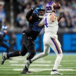 Detroit Lions defensive end Levi Onwuzurike (91) pressures Minnesota Vikings quarterback Sam Darnold (14) during the second half at Ford Field in Detroit on Sunday, Jan. 5, 2025.