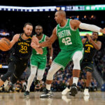 Jan 20, 2025; San Francisco, California, USA; Golden State Warriors guard Stephen Curry (30) dribbles the ball next to Boston Celtics center Al Horford (42) in the third quarter at the Chase Center.
