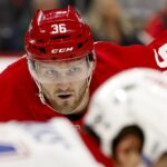 Jan 23, 2025; Detroit, Michigan, USA; Detroit Red Wings right wing Christian Fischer (36) gets set during a face off in the second period against the Montreal Canadiens at Little Caesars Arena. Mandatory Credit: Rick Osentoski-Imagn Images