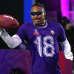 Jan 30, 2025; Orlando, FL, USA; NFC wide receiver Justin Jefferson of the Minnesota Vikings (18) catches the ball during the Satisfying Catch event at the Pro Bowl Skills Challenge at Nicholson Fieldhouse. Mandatory Credit: Kirby Lee-Imagn Images