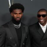 Feb 6, 2025; New Orleans, LA, USA; Deion Sanders (right) with his son Shedeur Sanders on the red carpet before Super Bowl LIX NFL Honors at Saenger Theatre. Mandatory Credit: Kirby Lee-Imagn Images