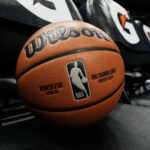 Feb 6, 2025; Denver, Colorado, USA; General view of a NBA Wilson basketball on the Denver Nuggets bench of Ball Arena before a game against the Orlando Magic.