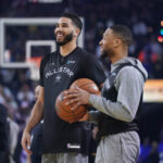 Feb 15, 2025; Oakland, CA, USA; Shaq’s OGs forward Jayson Tatum (0) of the Boston Celtics interacts with guard Damian Lillard (0) of the Milwaukee Bucks during the NBA All Star-Practice at Oracle Arena.